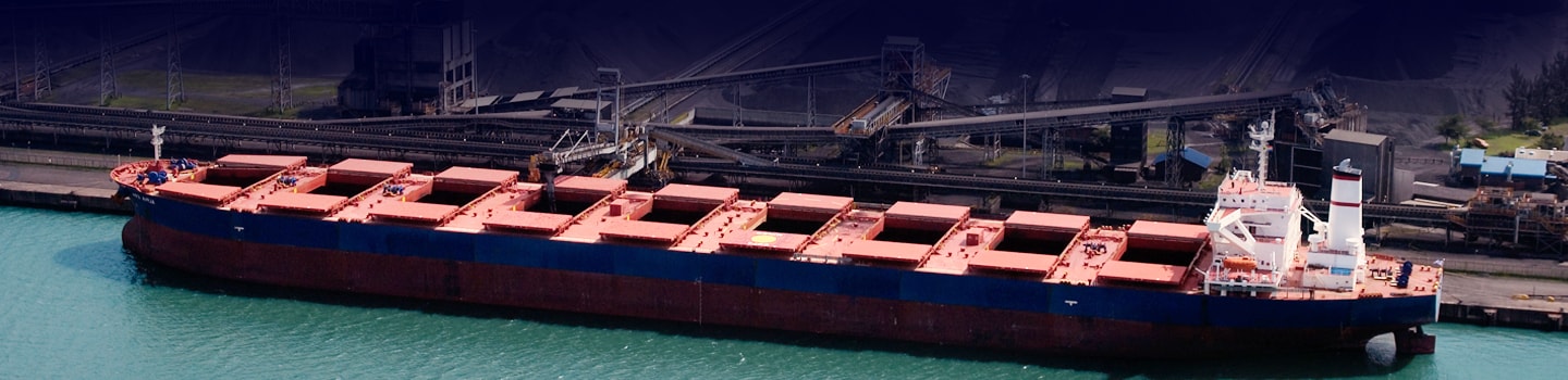 Ship unloader automation system with hatch scanning and collision avoidance